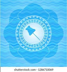 paper pin icon inside water concept badge background.