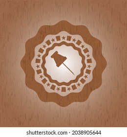 paper pin icon inside wood emblem. 