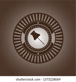 paper pin icon inside wooden emblem. Retro