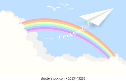 Paper plane fly over a rainbow and clouds. Travel concept.