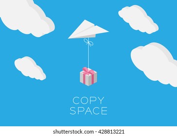 Paper plane hanging gift box flying in the blue sky and cloud background with copy space, postcard size 5x7 inches