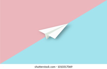 Paper plane on blue and red pastel background. 