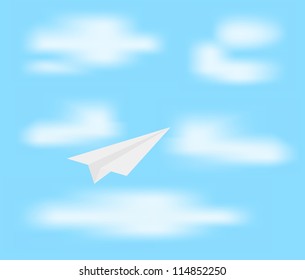 Paper plane on blue sky with clouds