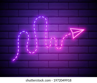 Paper plane with path neon sign.Bright paper plane . Night bright advertisement. Vector illustration in neon style for travel and vacation isolated on brick wall.