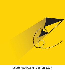 paper plane with shadow on yellow background