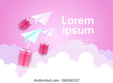 Paper Plane In Sky Over Pink Clouds And Gift Boxes Background Valentine Day Concept