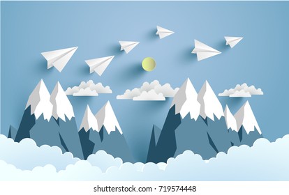 paper planes cross mountains and clouds with beautiful scenery
