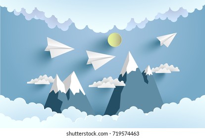 paper planes cross mountains and clouds with beautiful scenery