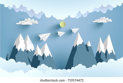 paper planes cross mountains and clouds with beautiful scenery