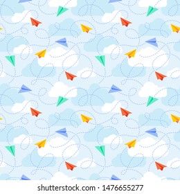Paper planes with flight traces and clouds in the blue sky seamless vector pattern.