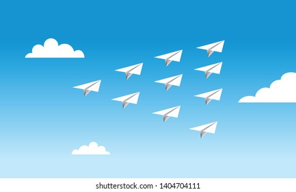 paper planes in formation, blue sky 
