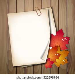 Paper sheet with autumn leaves on wooden background texture. Vector illustration
