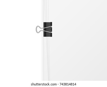 Paper sheet and binder clip on a white background.