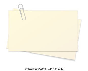 Paper sheet and paper clip on a white background.
