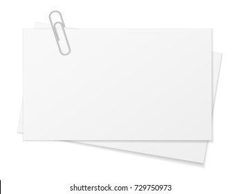 Paper sheet and paper clip on a white background.