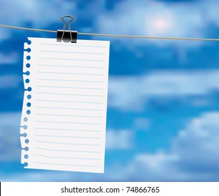 paper sheet on a clothes line with clouds