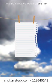 paper sheet on a wooden clips with clouds