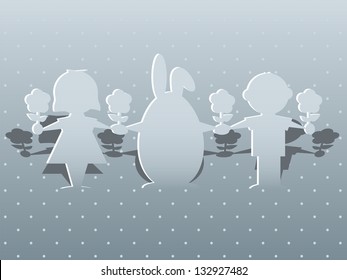 Paper silhouettes of children and the Easter bunny on a greeting card