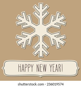 Paper snowflake and a frame with New Year greetings over brown backgrounds.