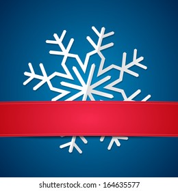 Paper snowflake on blue background with copy space red line