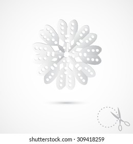 Paper snowflake on grey background. 3D Paper folding texture. Handmade, paper cut with scissors. Old style hobby preparation for New year and Christmas Holidays.