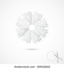 Paper snowflake on grey background. 3D Paper folding texture. Handmade, paper cut with scissors. Old style hobby preparation for New year and Christmas Holidays.