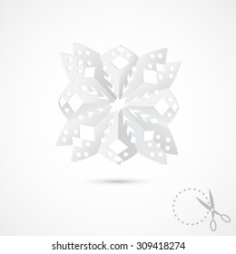 Paper snowflake on grey background. 3D Paper folding texture. Handmade, paper cut with scissors. Old style hobby preparation for New year and Christmas Holidays.