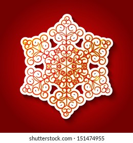 Paper snowflake on red background