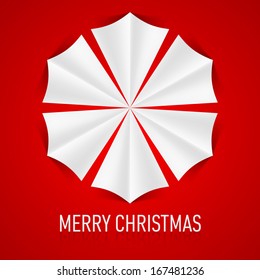 Paper snowflake on red background. Christmas card.