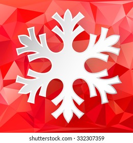 Paper snowflake over abstract geometric background consisting of colored triangles.