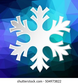 Paper snowflake over abstract geometric background consisting of colored triangles.