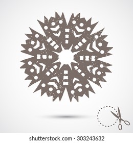 Paper snowflake with scratches on grey background. Silhouette. Handmade, paper cut with scissors. Old style hobby preparation for New year and Christmas Holidays.