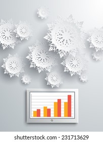 Paper snowflakes and modern device on gray background