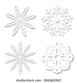 Paper snowflakes with soft shadows on a white background. realistic vector illustration.