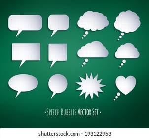Paper speech bubbles on school board background.