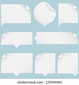 Paper Speech Bubbles - Set of paper speech bubbles isolated on blue background.