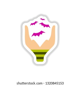 paper sticker on background of hand bat