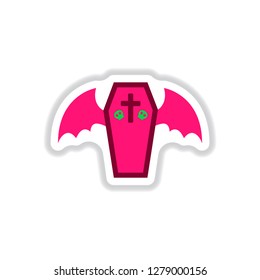 paper sticker on background of winged coffin
