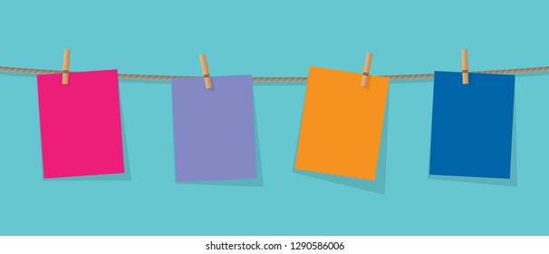 Paper stickers fixed on the rope with clothespins