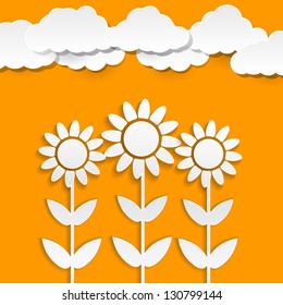 Paper sunflowers on orange background