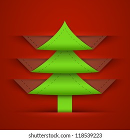 Paper vector green christmas tree sticking out of the divider on red paper background.