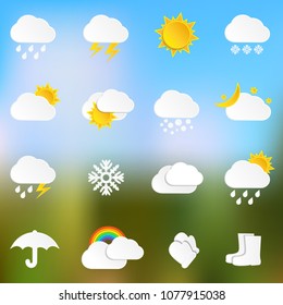 Paper weather icons on blurred background