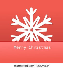Paper white snowflake on a red background 