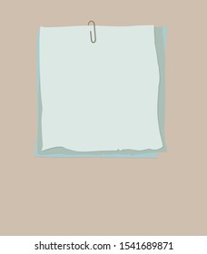 Paperclip with blank notepaper on orange background.