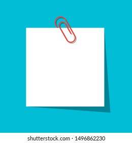 Paperclip With Blank White Notepaper On Blue Background