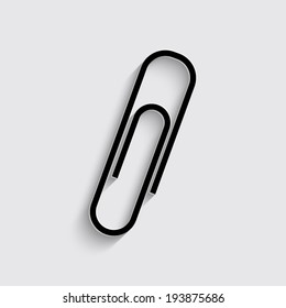  paperclip icon with shadow on a grey background