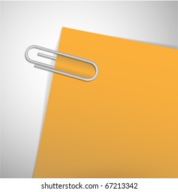 paperclip on the yellow paper