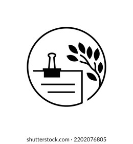 Papers in a binder and a plant forming a circle