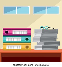 papers and stacked of binder in a office