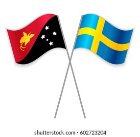 Papuan and Swedish crossed flags. Papua New Guinea combined with Sweden isolated on white. Language learning, international business or travel concept.